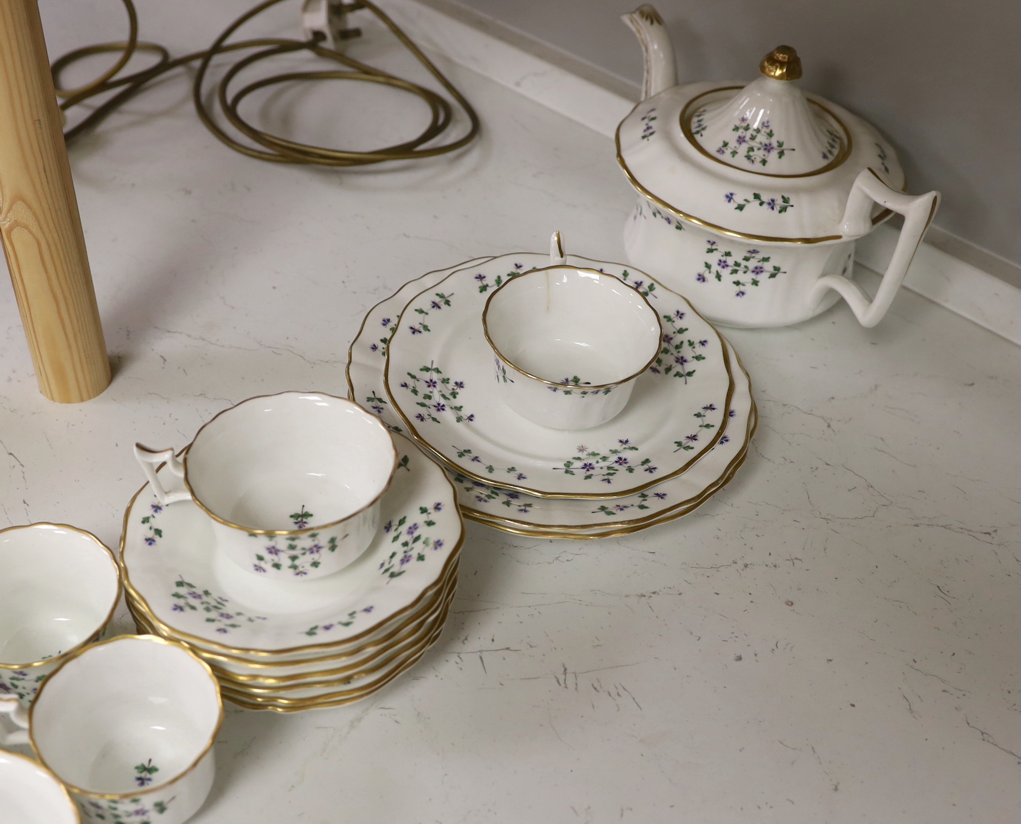 A Victorian bone china part teaset, painted with flowers, the largest 27cm wide